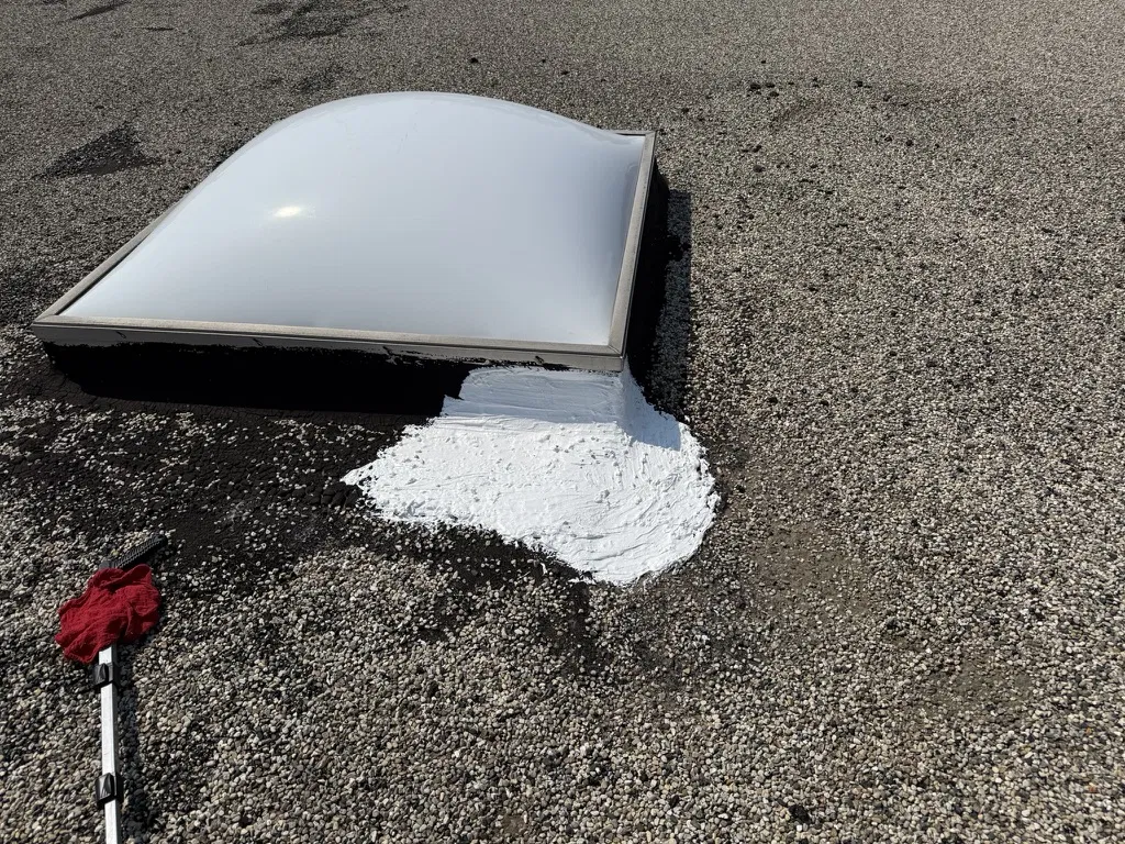 Commercial roof lap seam patched and re-adhered