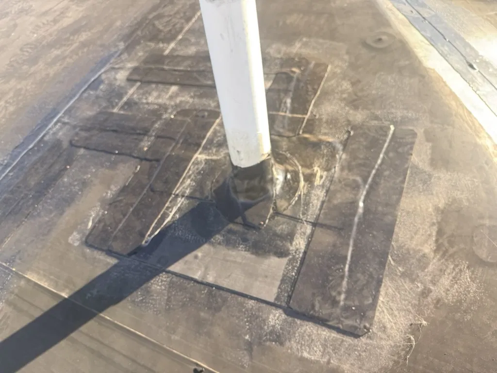 EPDM membrane tear repaired with patch material